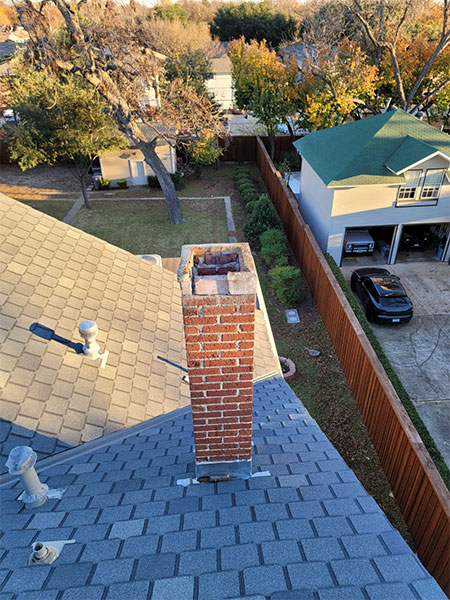 Chimney on top of a residential roof